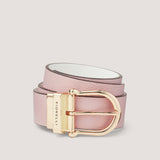 A stylish, reversible pink belt with a sleek gold buckle.