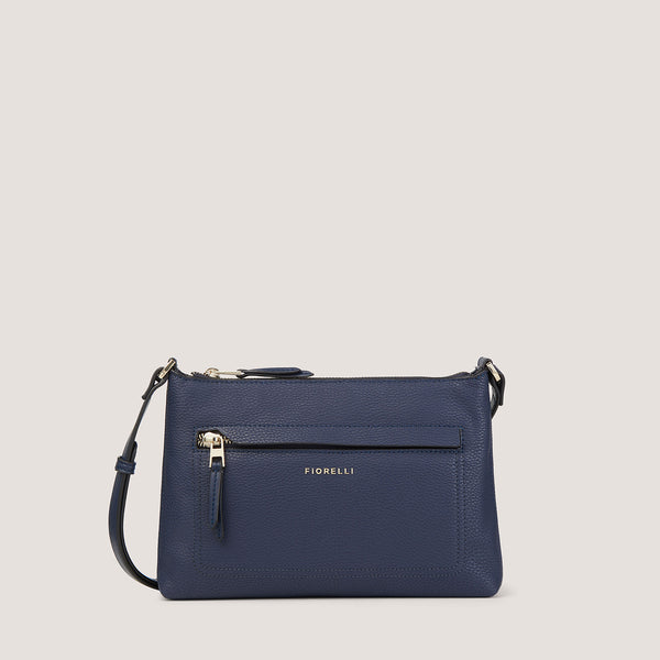 Our newest Eden crossbody in navy is perfect for when you want to travel light. 