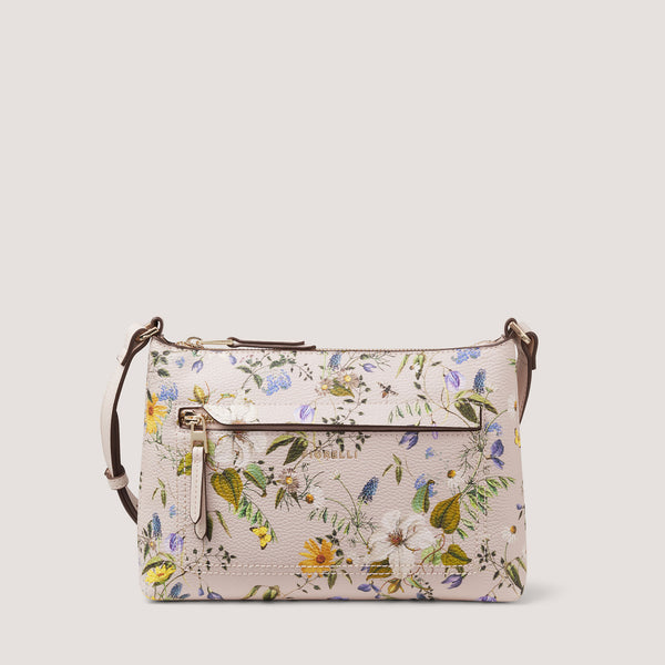 The perfect size to hold all your essentials, the floral printed Eden crossbody bag features a concealed-zip front pocket for a minimalist feel.