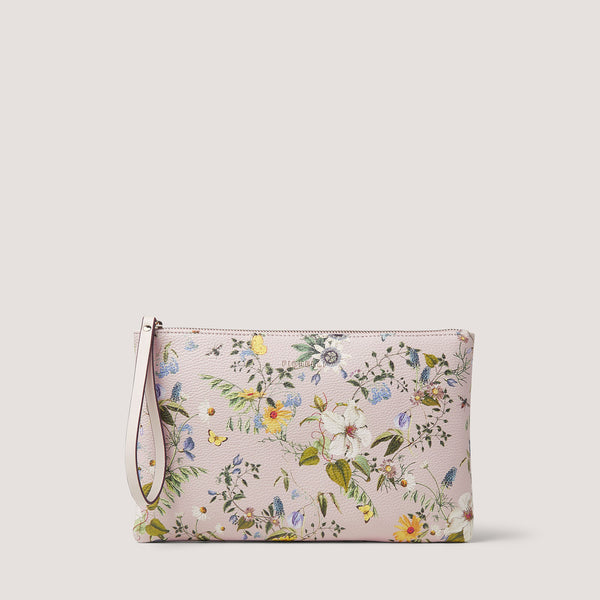 The Lana pouch comes in a white floral print. Carry it by the wrist strap or tuck it neatly under your arm.