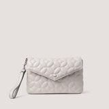 Light-stone petal quilt envelope clutch with wristlet strap.