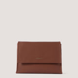 Tan crossbody bag with magnetic flap.