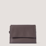 Coffee brown crossbody bag with magnetic flap.