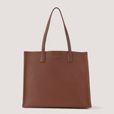 Tan large tote bag with cushioned straps.