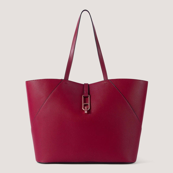 Red large tote bag with twist lock detail.