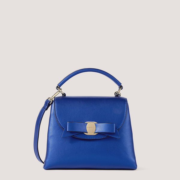 Metallic blue mini handbag with bow detail.