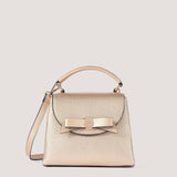 Gold mini handbag with bow detail.