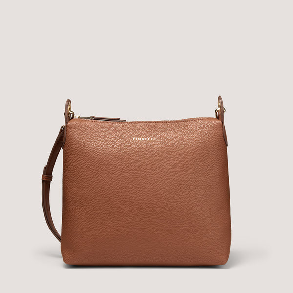 Tan crossbody bag with metal eyelets.