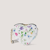 Wildflower print heart-shaped bag with crossbody strap.