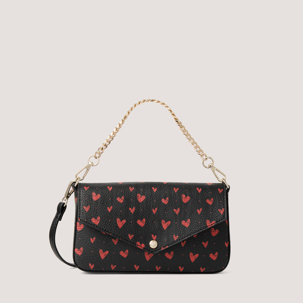 Scattered heart print crossbody bag with gold-tone chain handle.