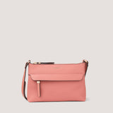 Camellia-pink crossbody bag with concealed zip pocket.