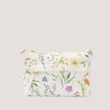 Sprinkled bloom crossbody bag with concealed zip pocket.