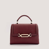 Port Red top-handle bag with crossbody strap.