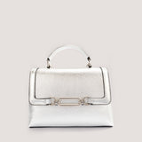 Silver top-handle bag with crossbody strap.