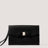 Black envelope clutch with bow detail.