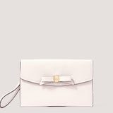 White envelope clutch with bow detail.