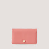 Camellia-pink bifold purse with branded hardware.