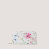 Wildflower print purse with multiple compartments.