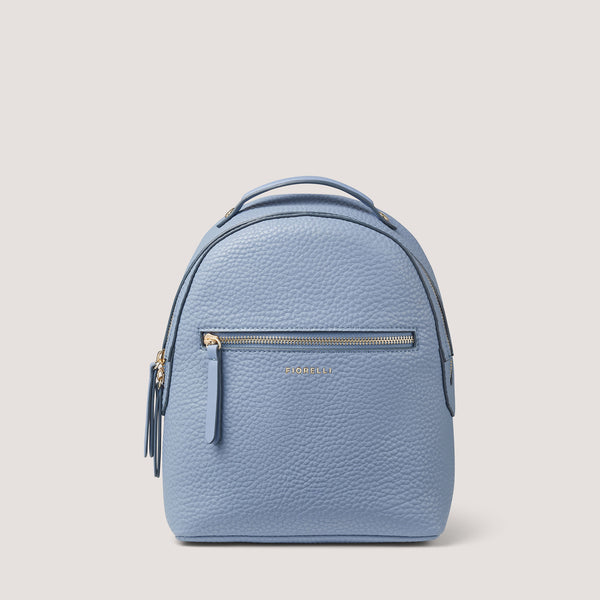 The Anouk backpack is re-imagined in light blue. It features front and back zip pockets, perfect for when you're on the go.