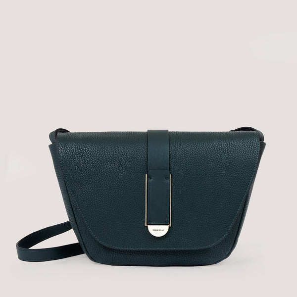 An understated and elegant new spruce green clutch bag that is the perfect day to night companion.