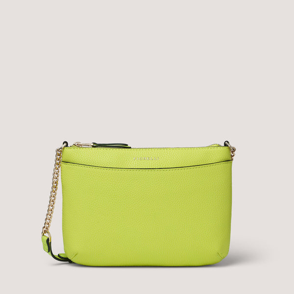 Crafted from faux leather in a playful lime green hue, the Astrid crossbody bag is a sleek occasion-ready style.