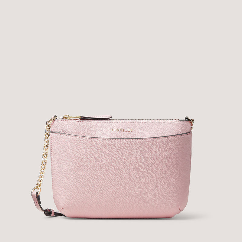 The sleek and occasion-ready Astrid crossbody bag is made from faux leather and comes in light pink.