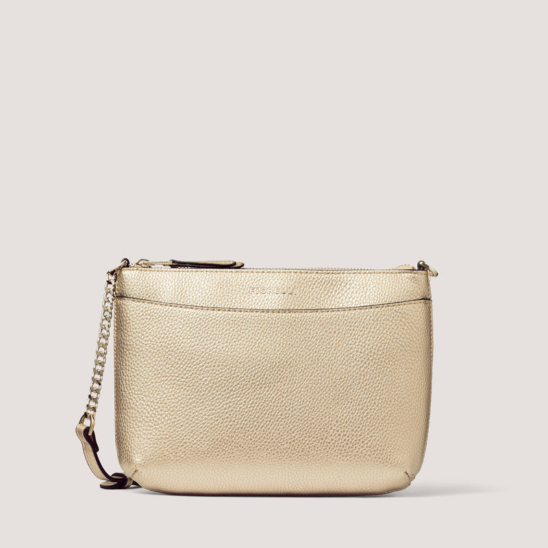 The gold Astrid crossbody bag is the perfect day to night style.