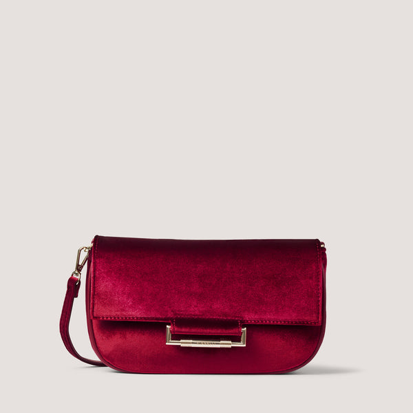 Our new red velvet Nova style can be worn as a crossbody, shoulder or clutch thanks to a removable and adjustable strap