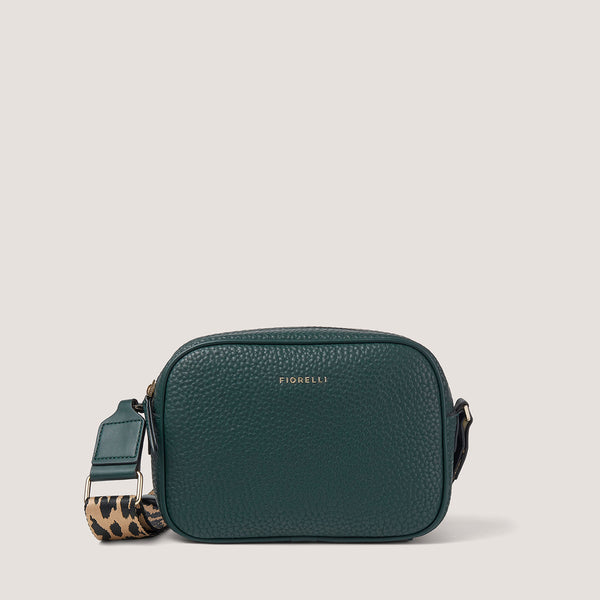An update on our classic camera style crossbody, the spruce green Lyra comes with a fabric leopard print strap.