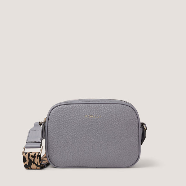 An update on our classic camera style crossbody, the steel blue Lyra comes with a fabric leopard print strap.