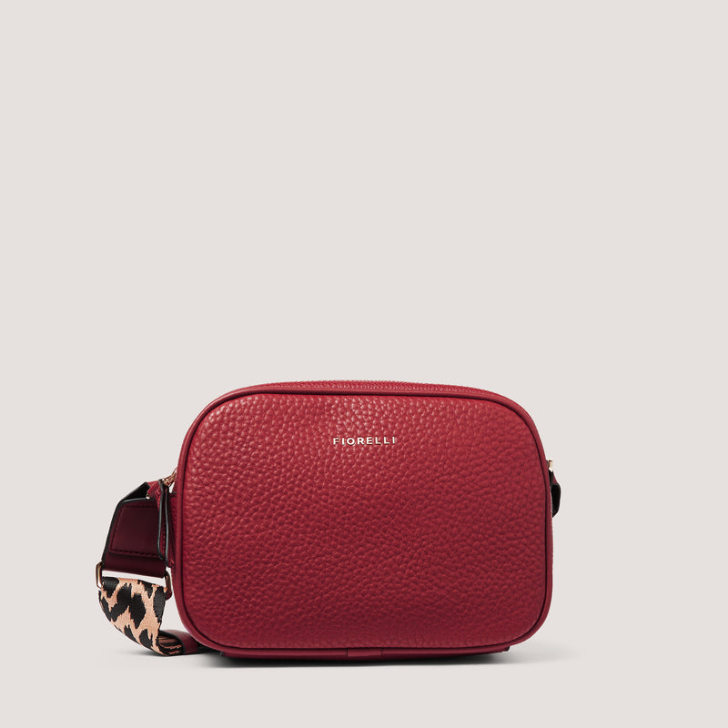 An update on our classic camera style crossbody, the red Lyra comes with a leopard print strap for a sleek yet unique look.