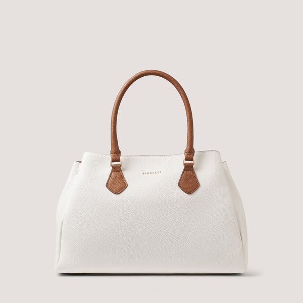 Designed to be worn multiple ways, the white and tan Paloma handbag can be worn across the body or in the crook of your arm.