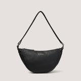 The Darcey bag in black has been consciously designed to sit at an angle, so you can wear it on one shoulder or cross-body.