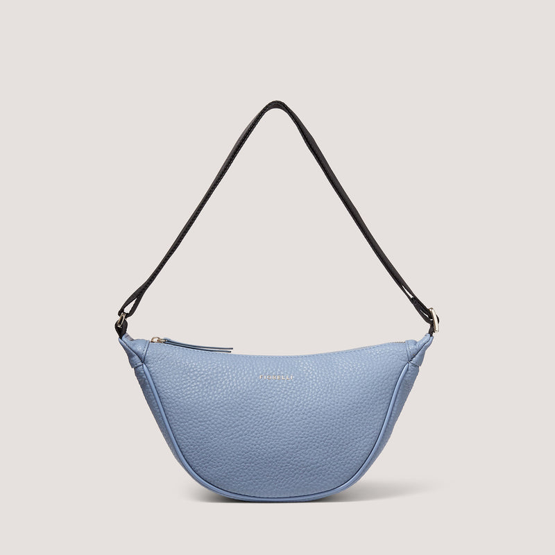 The Darcey bag in light blue has been consciously designed to sit at an angle, so you can wear it on one shoulder or cross-body.