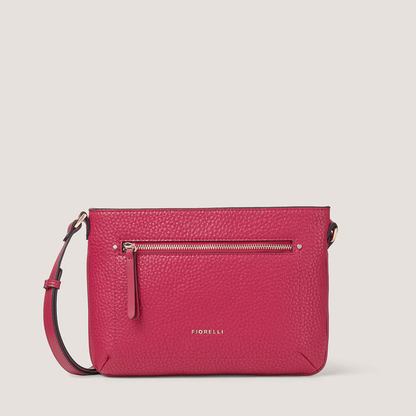 Our newest red faux leather crossbody features an adjustable crossbody strap and front zip pocket for pretty practicality. 