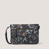 Our newest floral faux leather crossbody features an adjustable crossbody strap and front zip pocket for pretty practicality.