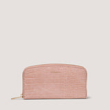 This curved pink croc purse has 12 internal card slots.