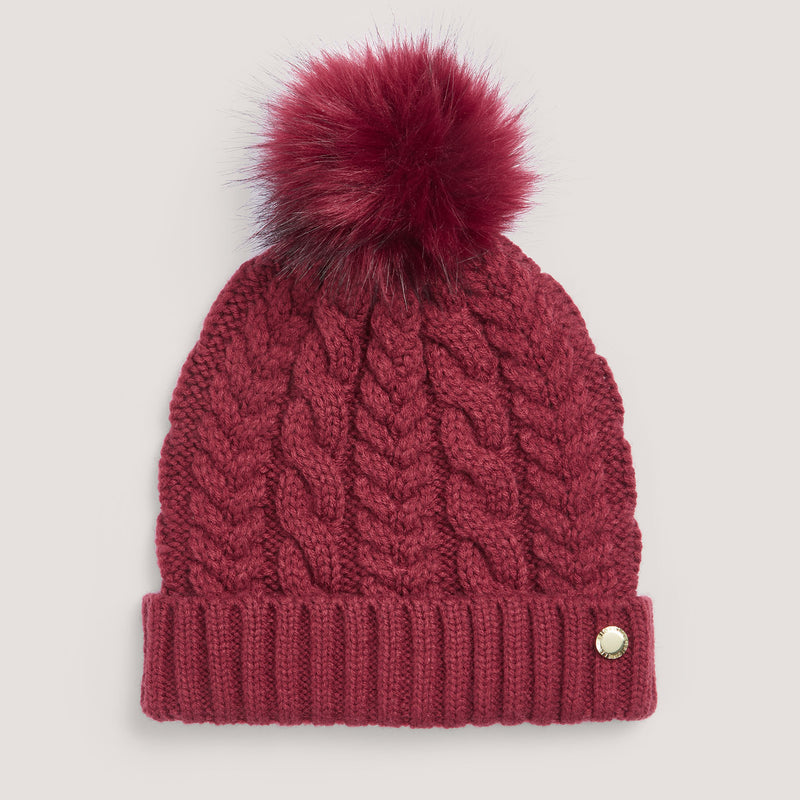 Bold red cable knit bobble hat.
